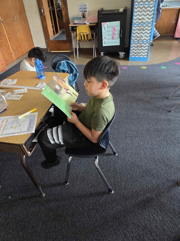 Students read their new RIF books.