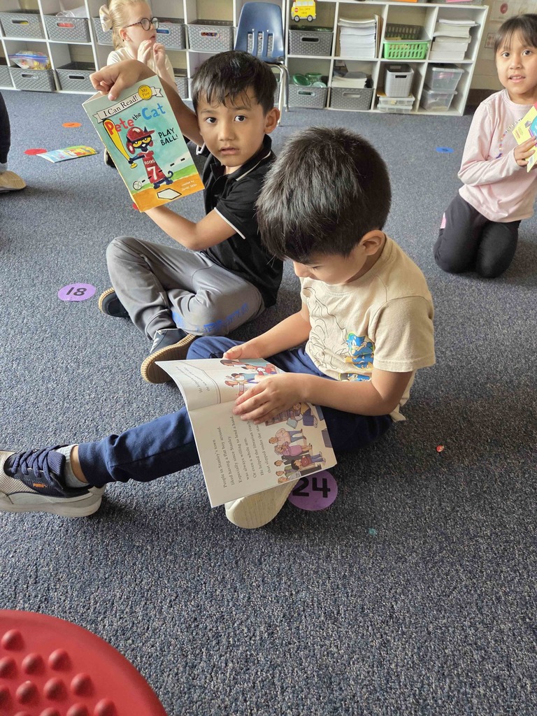 Students read their new RIF books.
