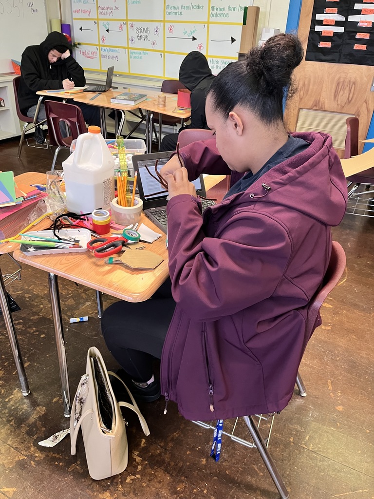 Students working on a science project in a classroom