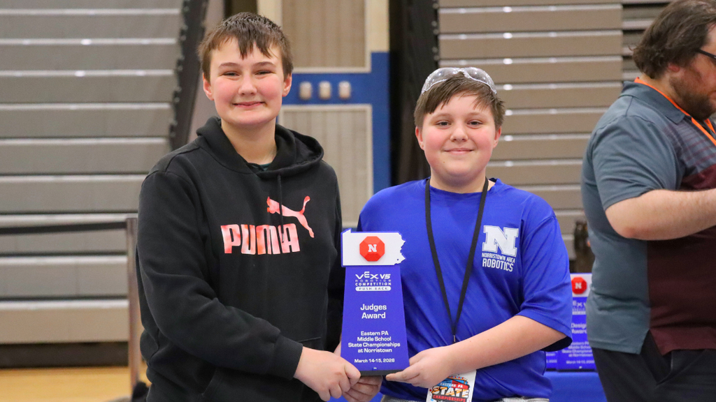 Middle school team 255T posing with their Judges Award Trophy. 