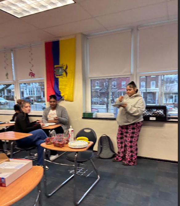 Students are eating their waffles in a classroom