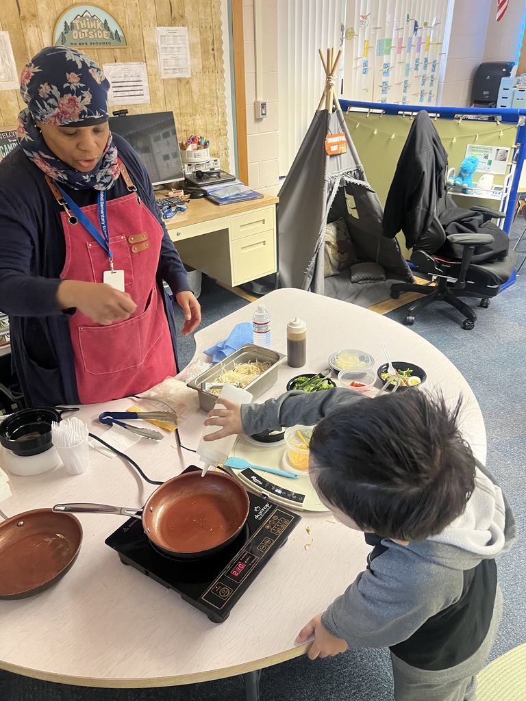 Chef Jamela B. cooking with a student.