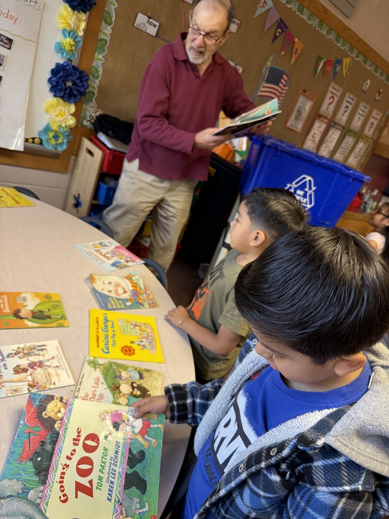 Mr. Dugan sharing books with Room 108.