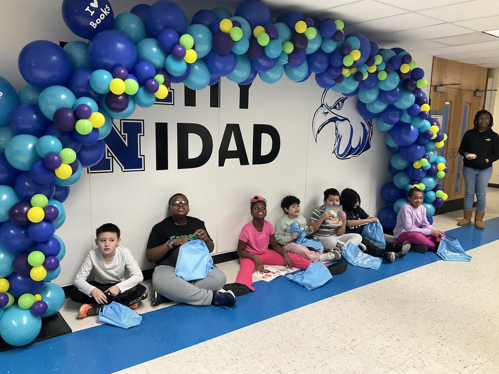 Students holding their bags with their new books