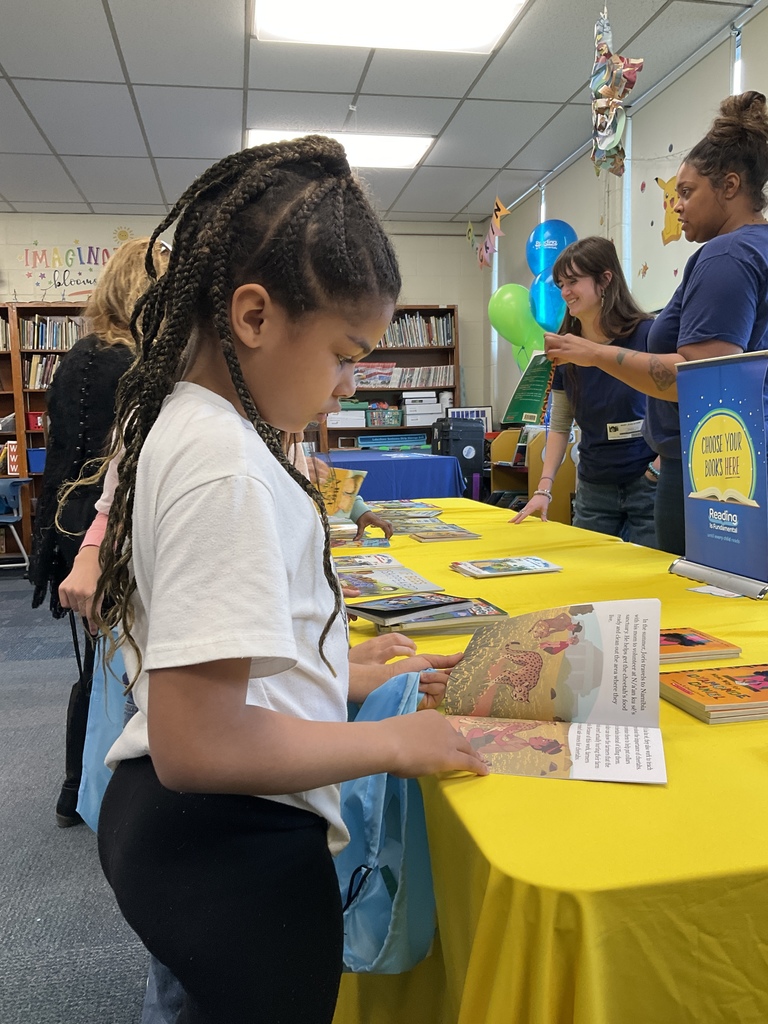 A student picking out a book