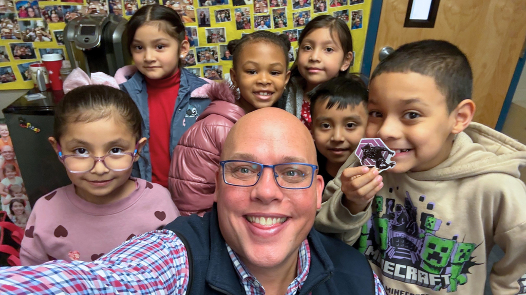 Dr. Smith takes a selfie with 6 students. 