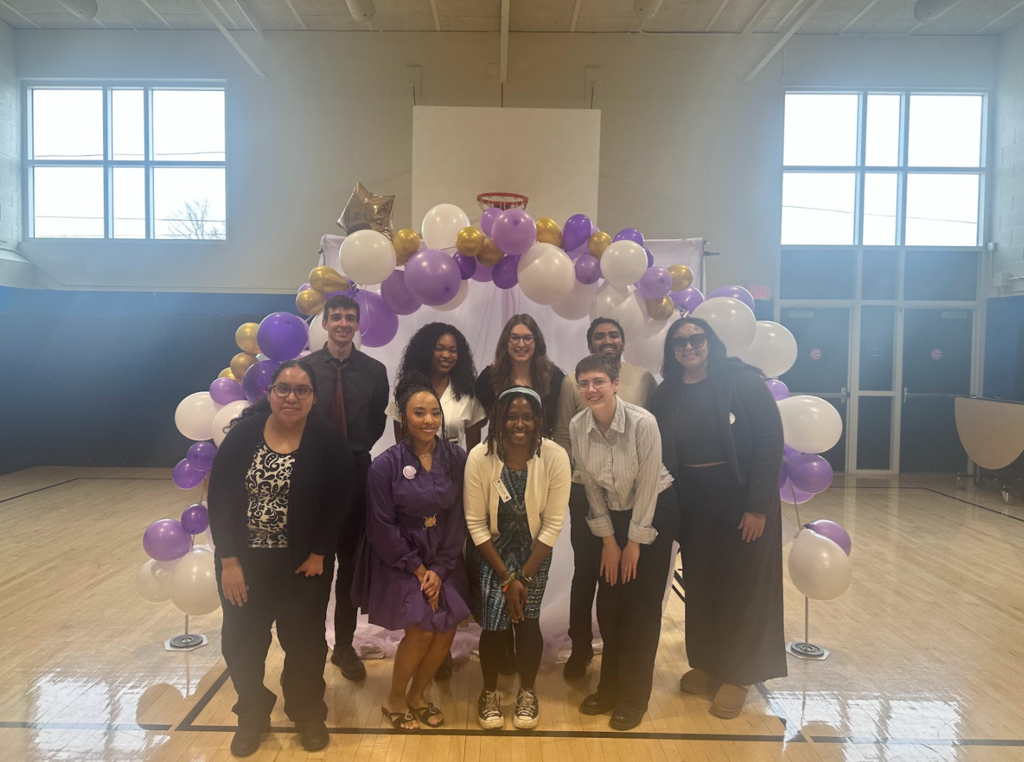 A photo of the entire City Year team under a balloon arch