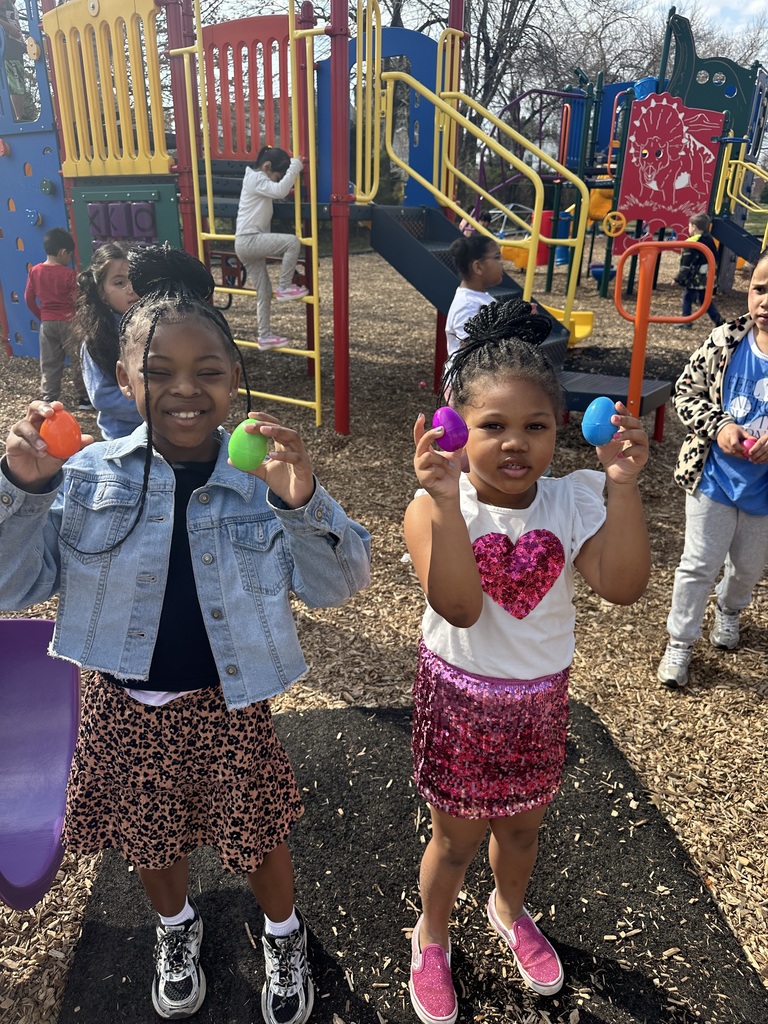 Kindergarteners participate in an egg hunt on the playground.