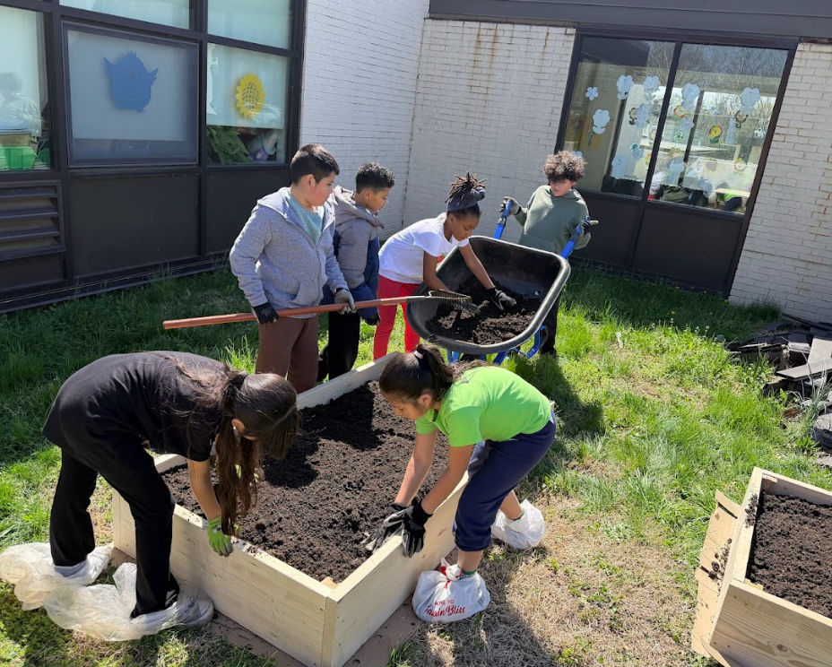 Students working together to prepare the gardens