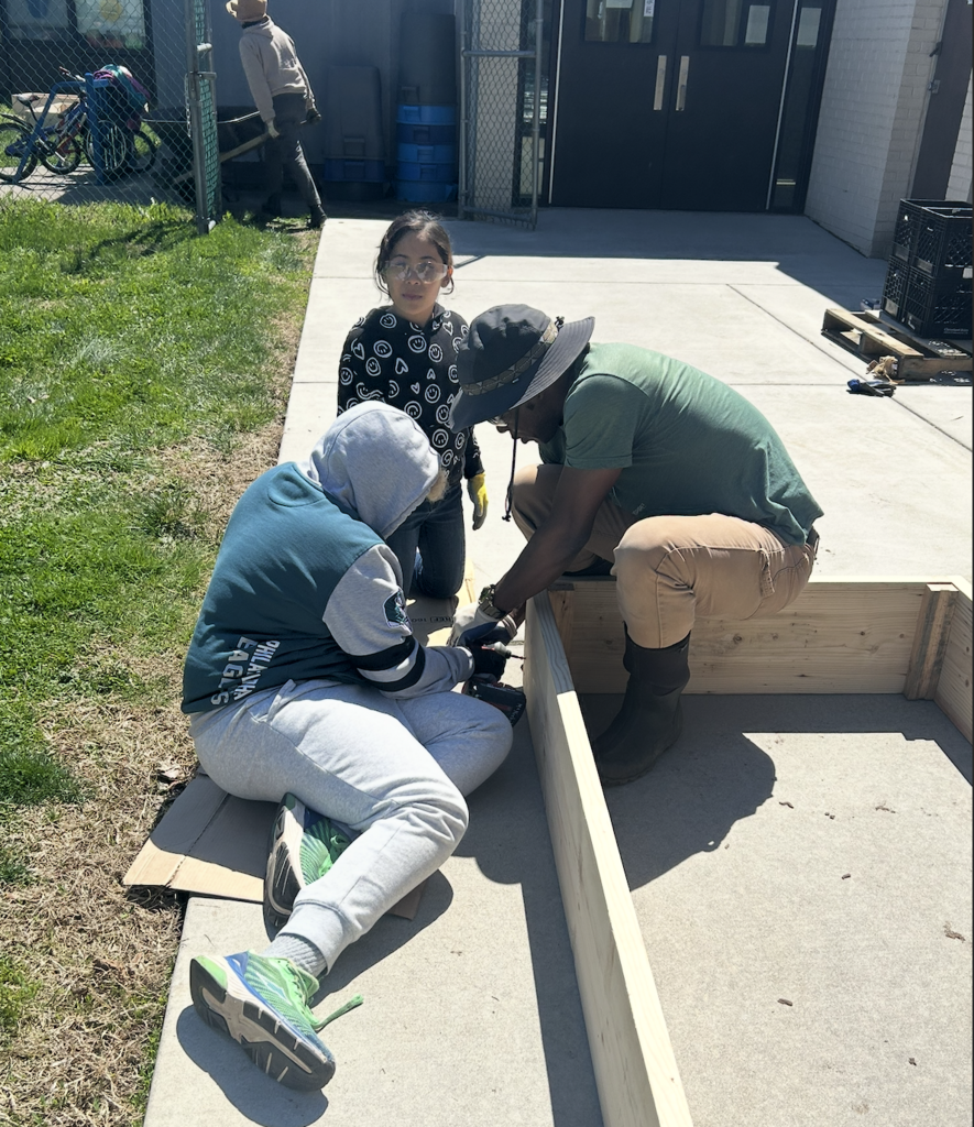 Students helping to prepare the flower beds