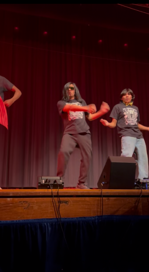 Students are dancing on the stage at NAHS for the pageant