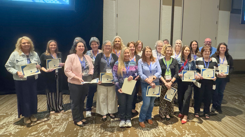 Large group of nominees pose for photo.