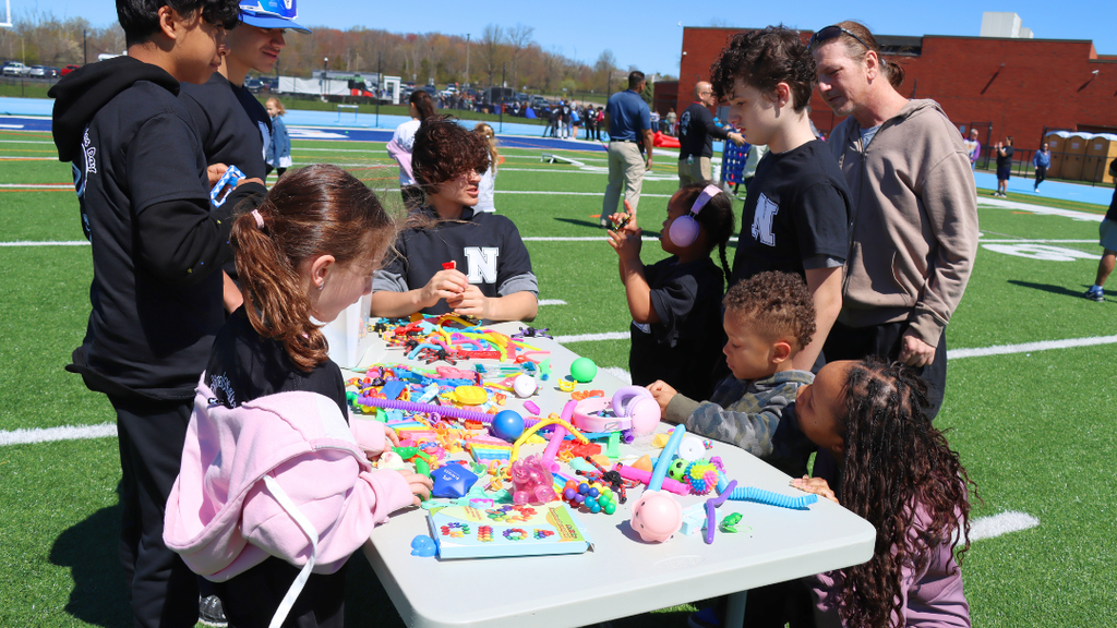 Students exploring different fidget at the sensory table during exceptional abilities day. 