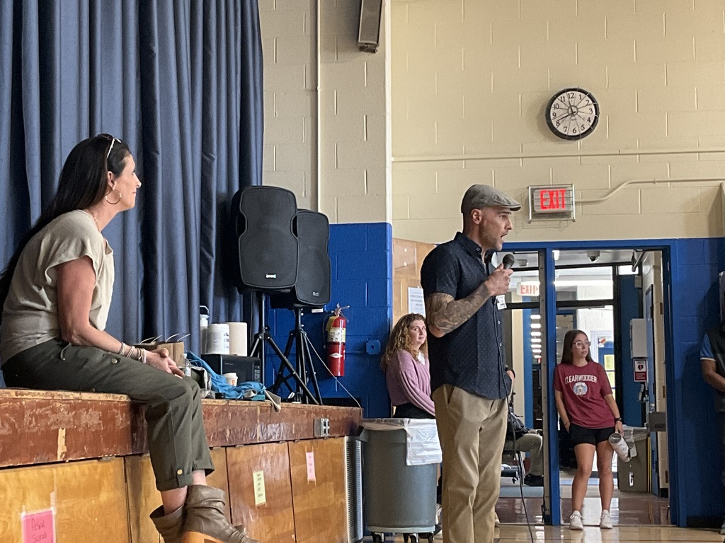 A photo of two presenters from St Joe’s are talking to students