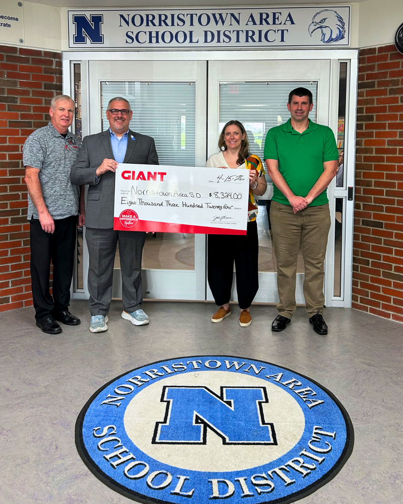 NASD Superintendent, CFO, and Food Services Director pose for photo with GIANT representative and with check from our local GIANT store.