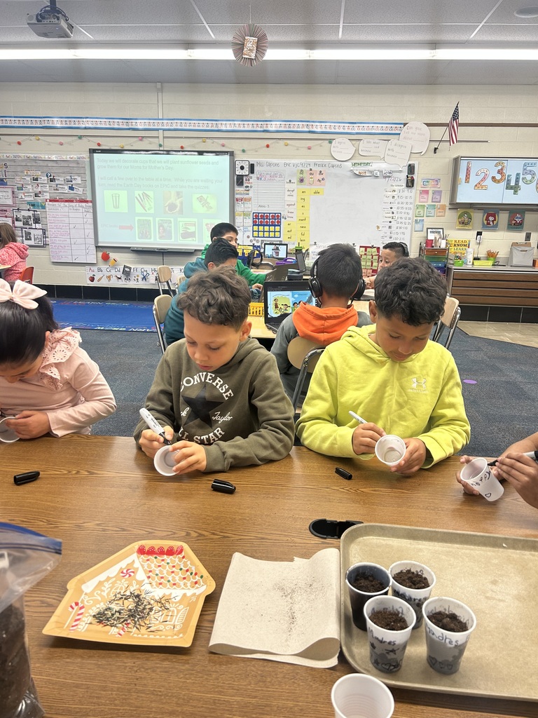 Second graders planting seeds on Earth Day.