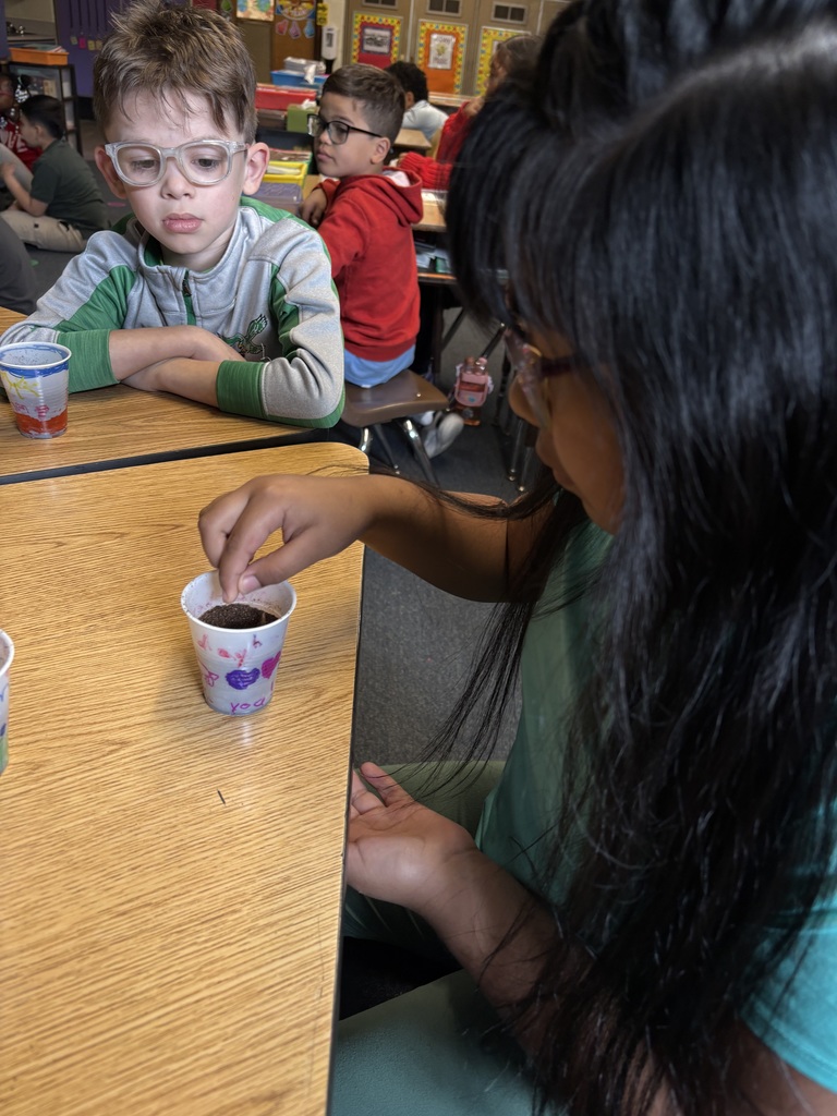 Second graders planting seeds on Earth Day.