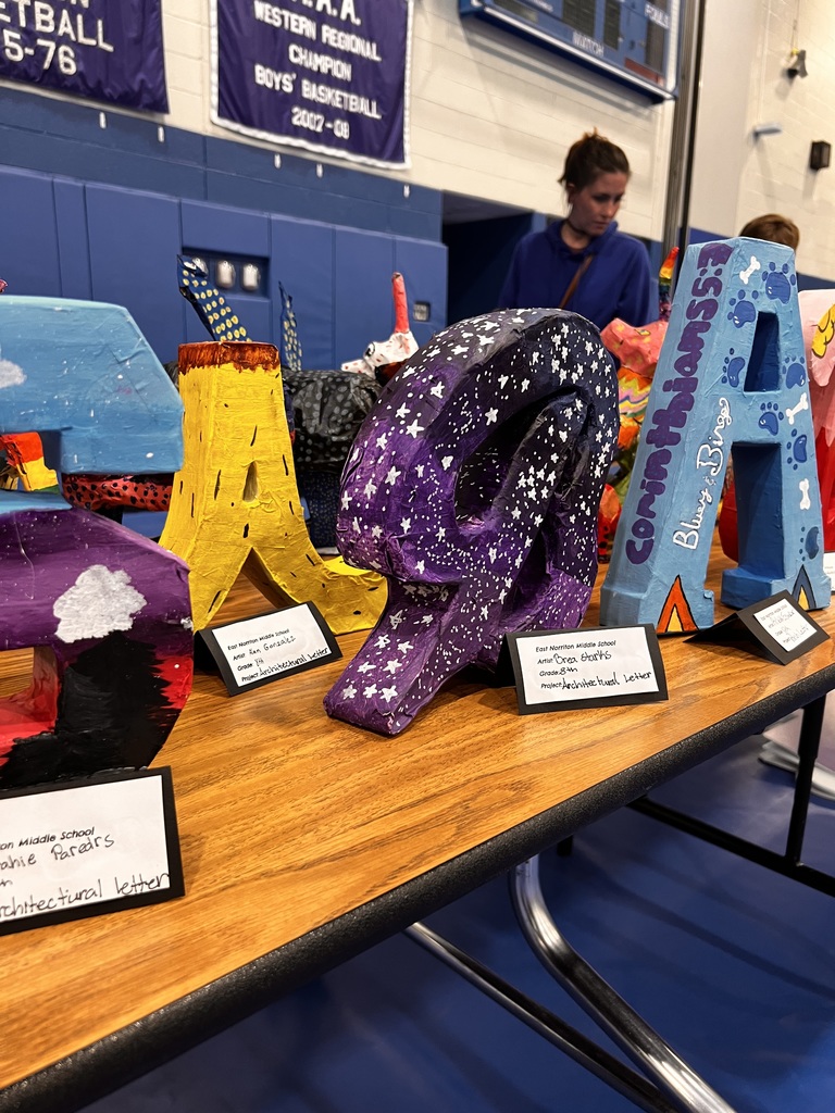 Paper-mache student work is on display.