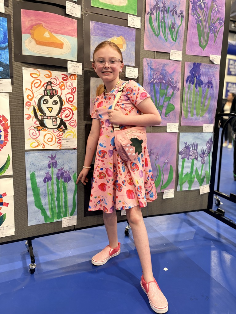 A Hancock student showing off their artwork.