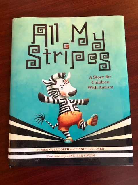 Reading the book All My Stripes. 