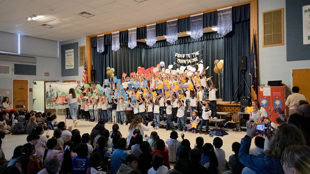 Kindergarteners sing "It's A Wonderful World" at their show.