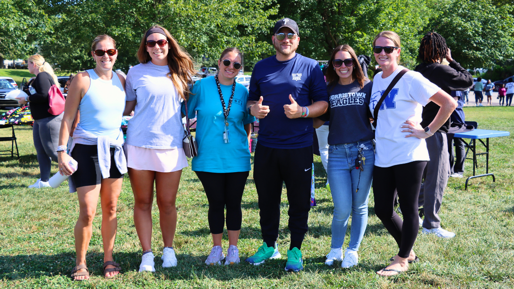 Group of six teachers pose for photo at back to school picnic event.