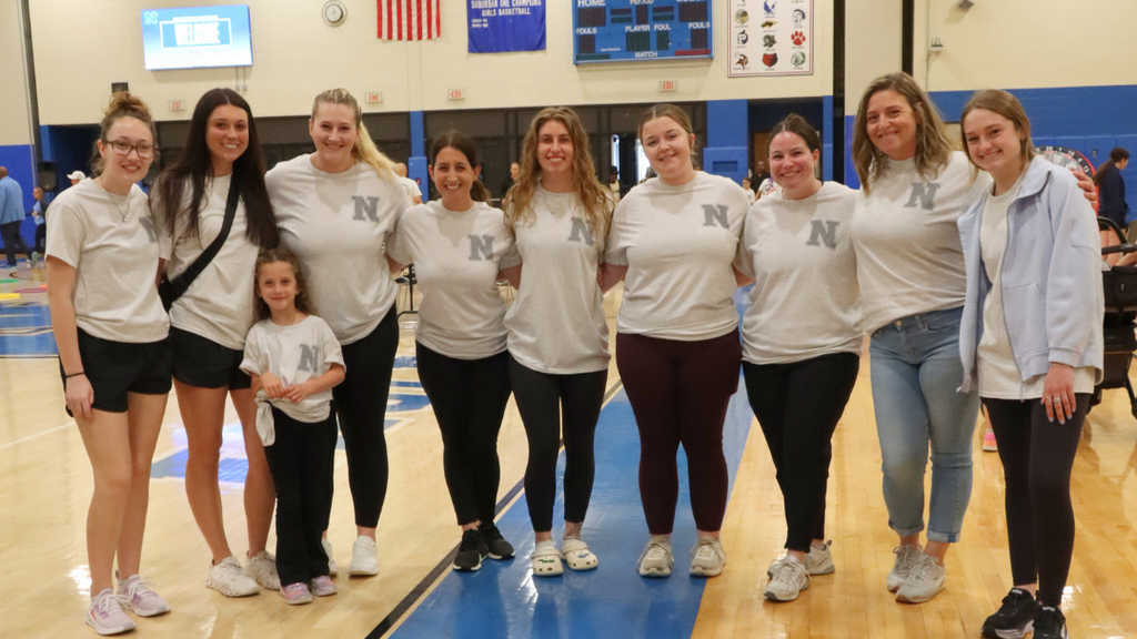 Group of teachers pose for photo. 