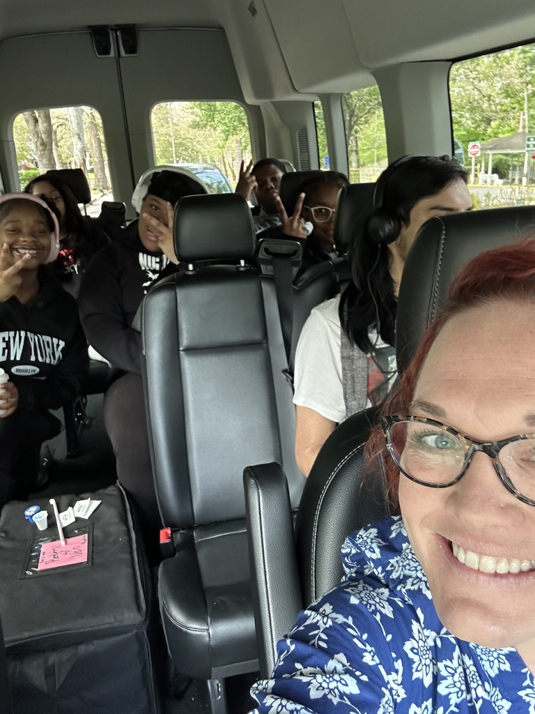 The counselor is in the van with students going to the summit