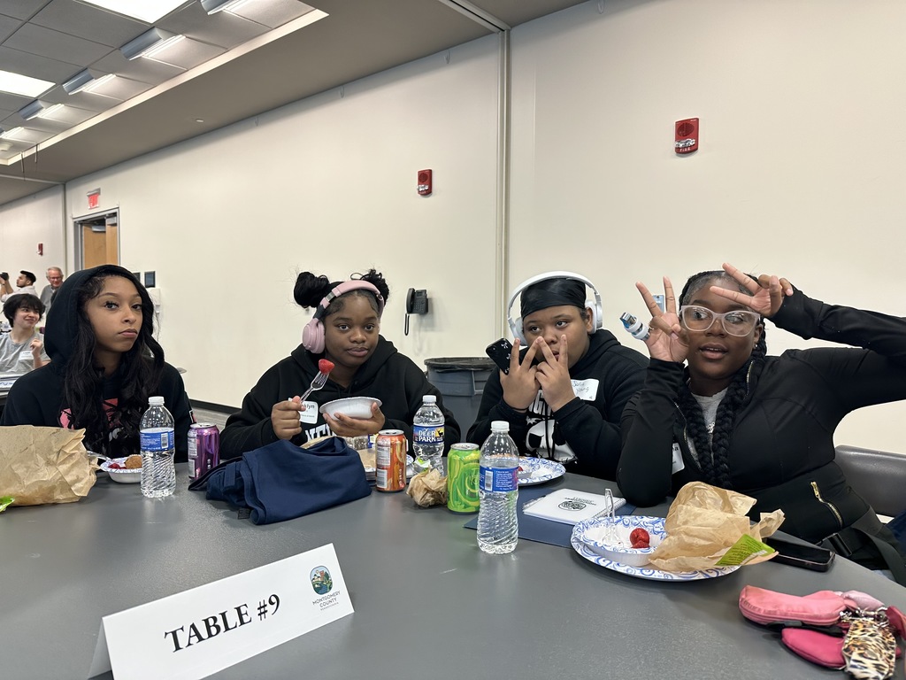 Three girls are having lunch together