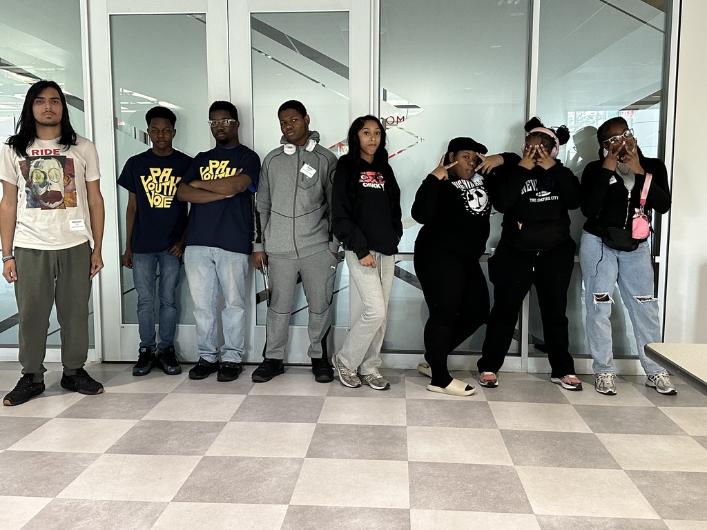 Students are posing together at the summit