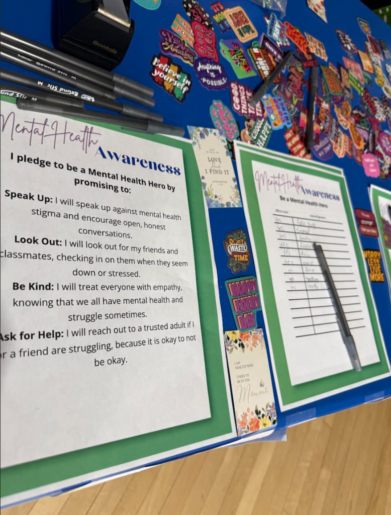 Materials are on a table for students to fill out