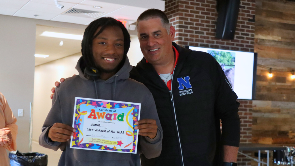 Kamal poses for photo with Mr. Ennis after receiving his certificate.