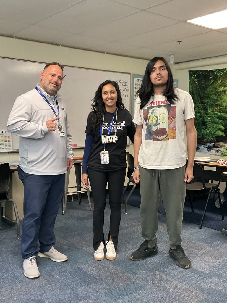A teacher, principal and student are together