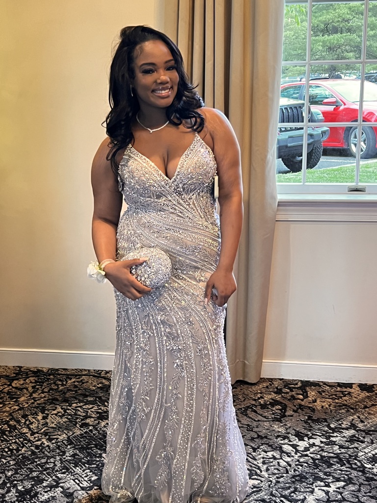 A female student is posing for prom