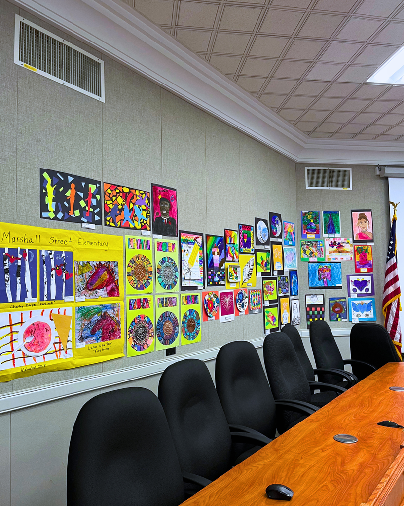 NASD Board Room with art from students hanging on the wall.