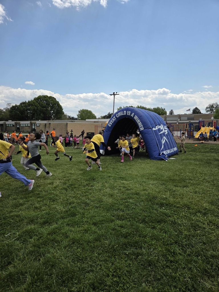 Students run through the tunnel at the Walk-a-Thon.