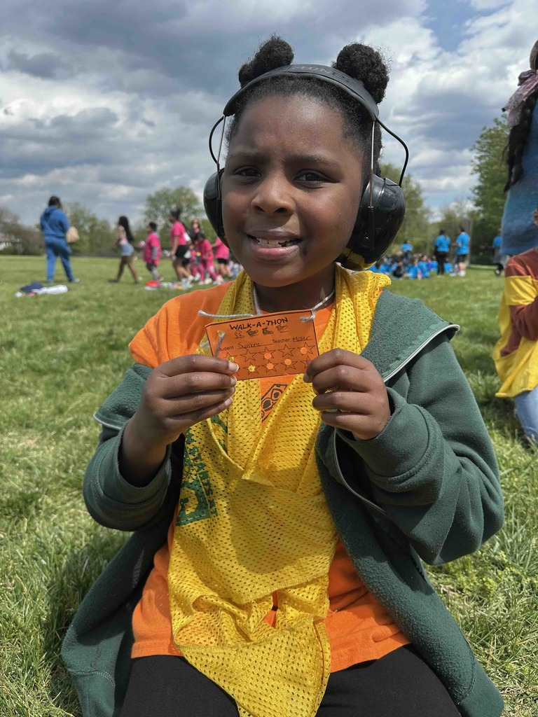 A student shows her lap card for the Walk-a-Thon.