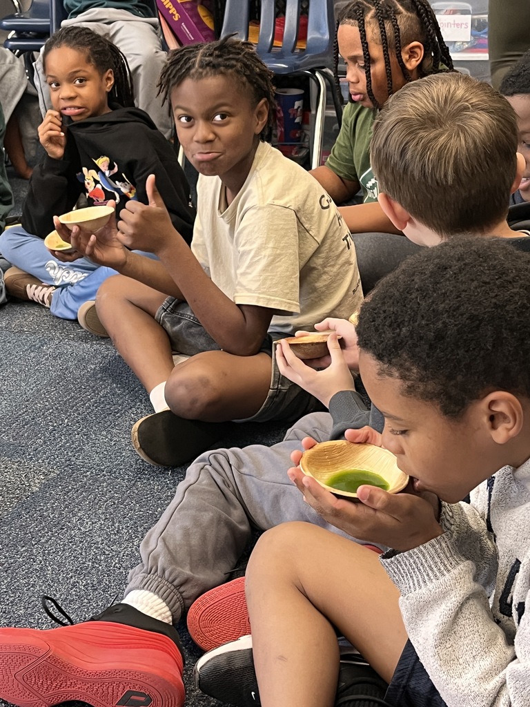 Third grade students at the tea ceremony enjoying their tea. 