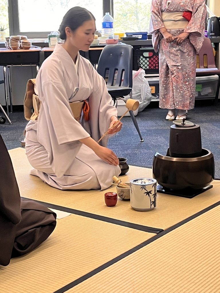 A presenter making tea. 
