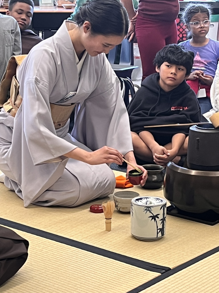 A presenter making tea. 