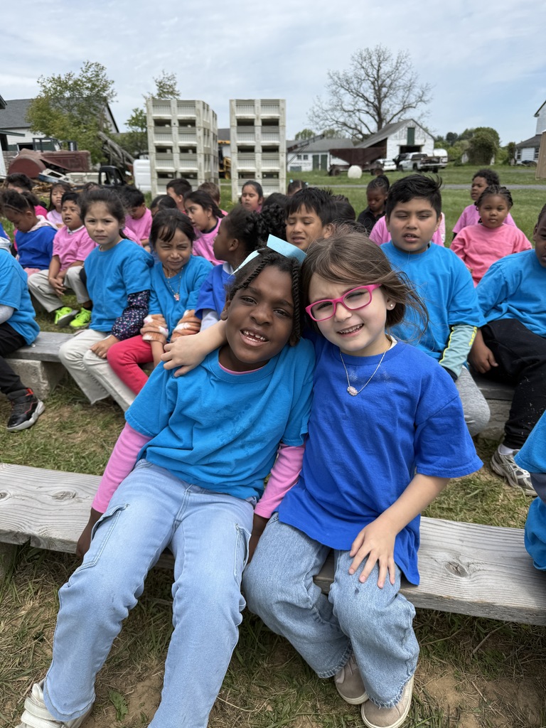 Kindergartners take a hay ride at the farm.
