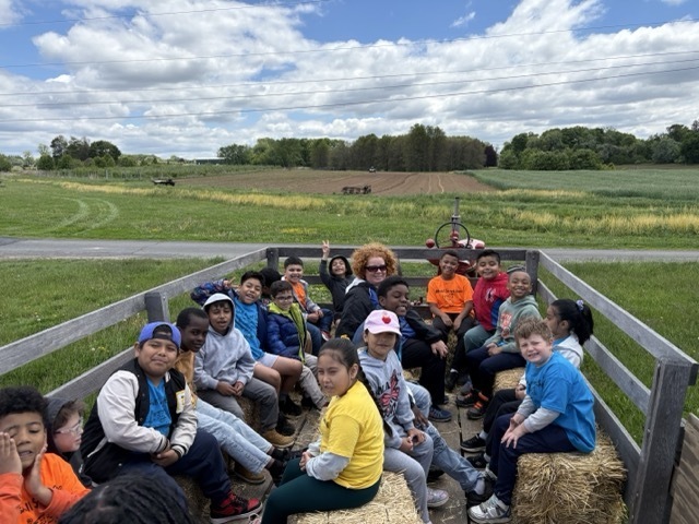 Students enjoy a hayride.