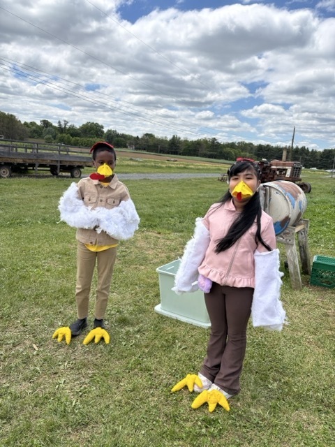 Students learn about chickens with a costume.