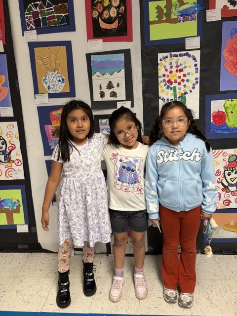 Three students at the art show