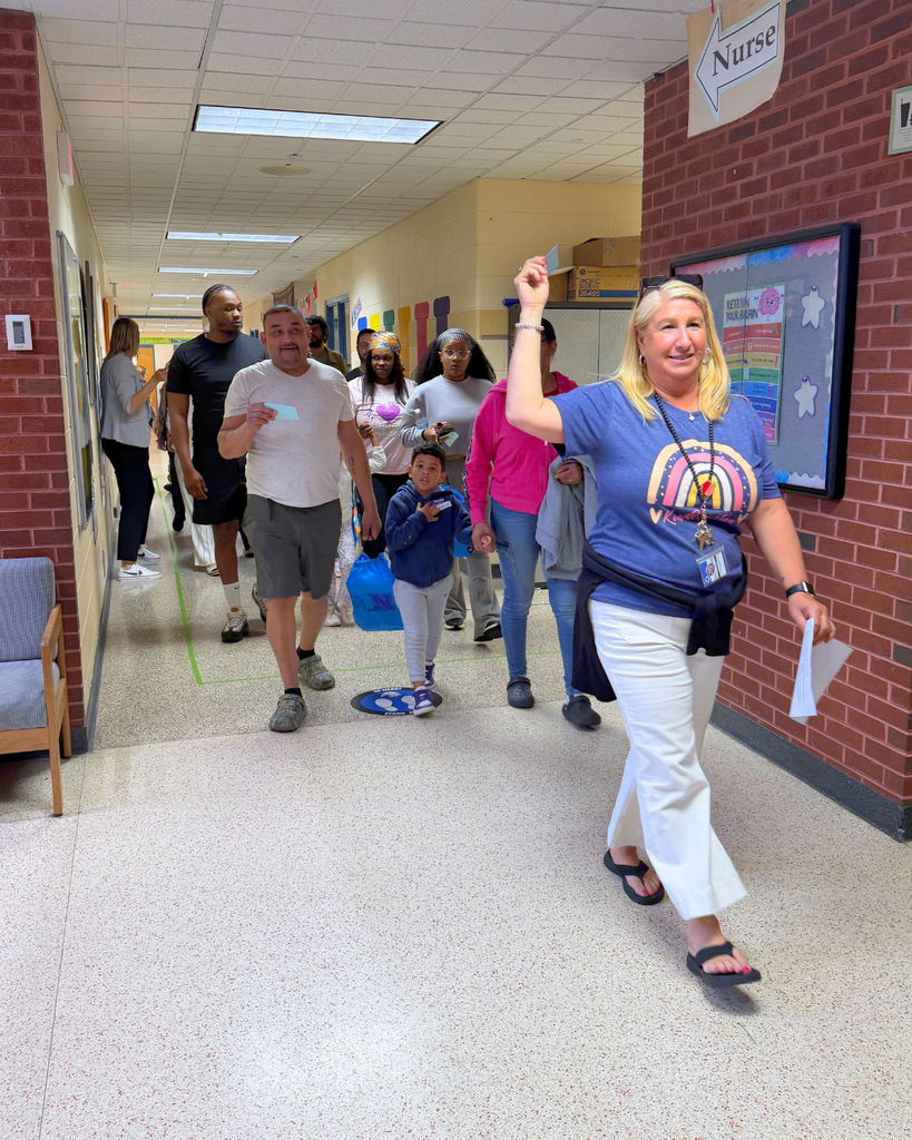 Whitehall teacher leading families on a tour of the building.