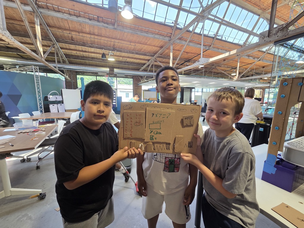 Students at the FluxSpace working together. 