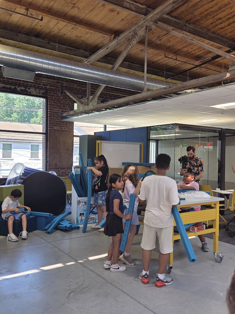 Students at the FluxSpace working together. 
