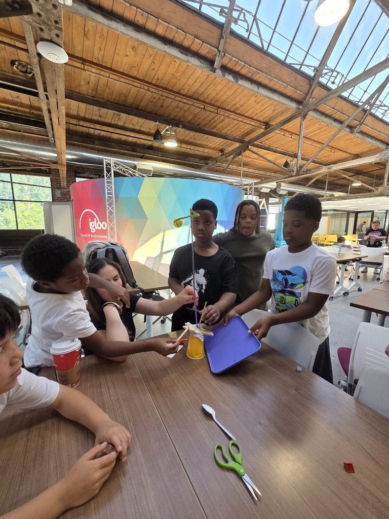 Students at the FluxSpace working together. 