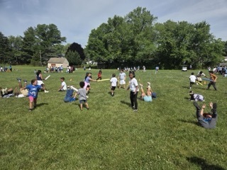 Students play Turtle Tag at Field Day.