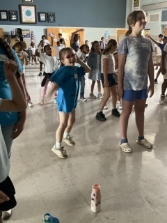 Student dance to fun music at Field Day.